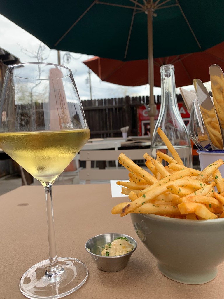 Patio at Bell's with wine and fries